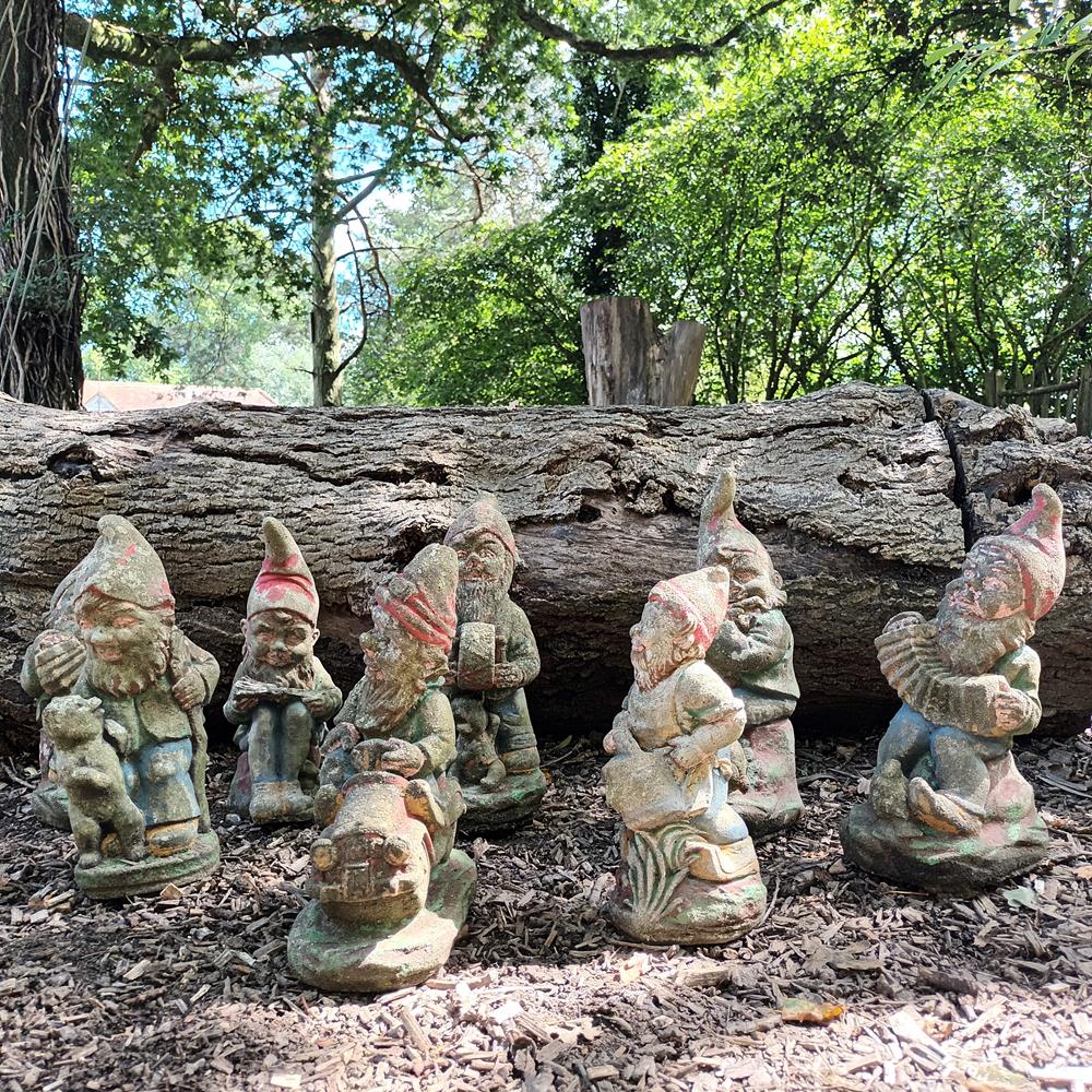 A Set Of Eight Garden Gnomes