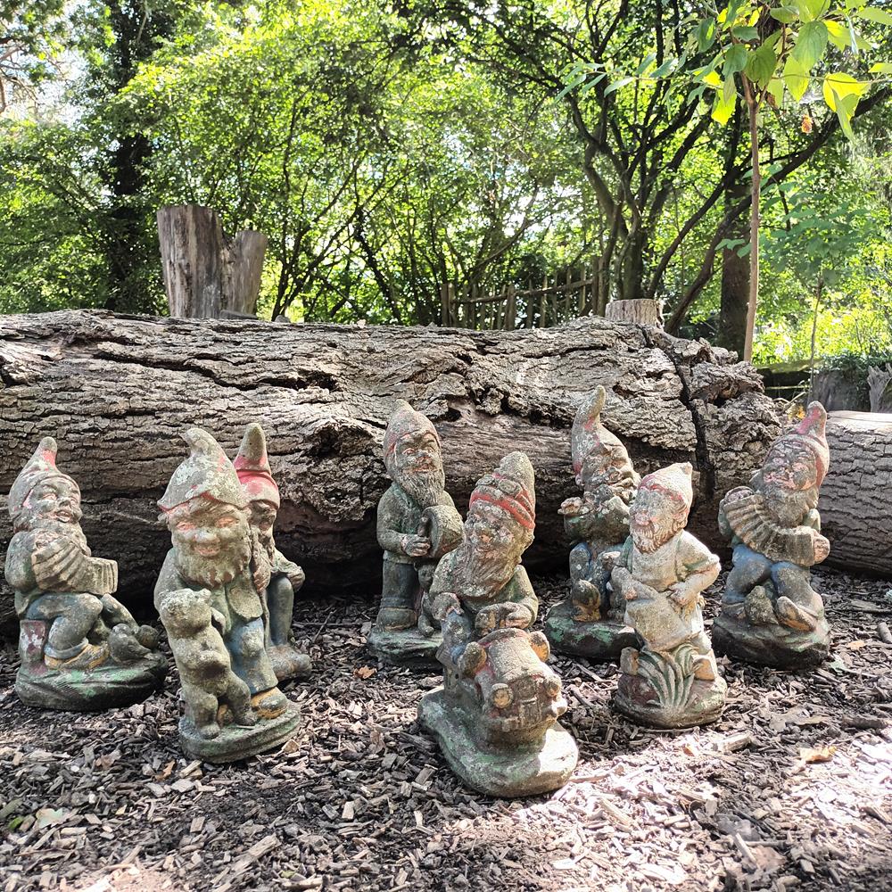 A Set Of Eight Garden Gnomes