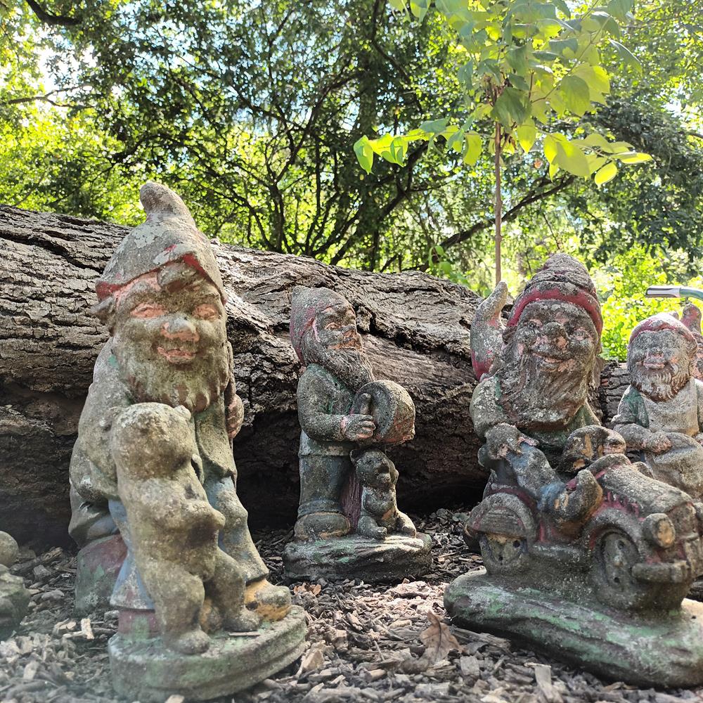 A Set Of Eight Garden Gnomes