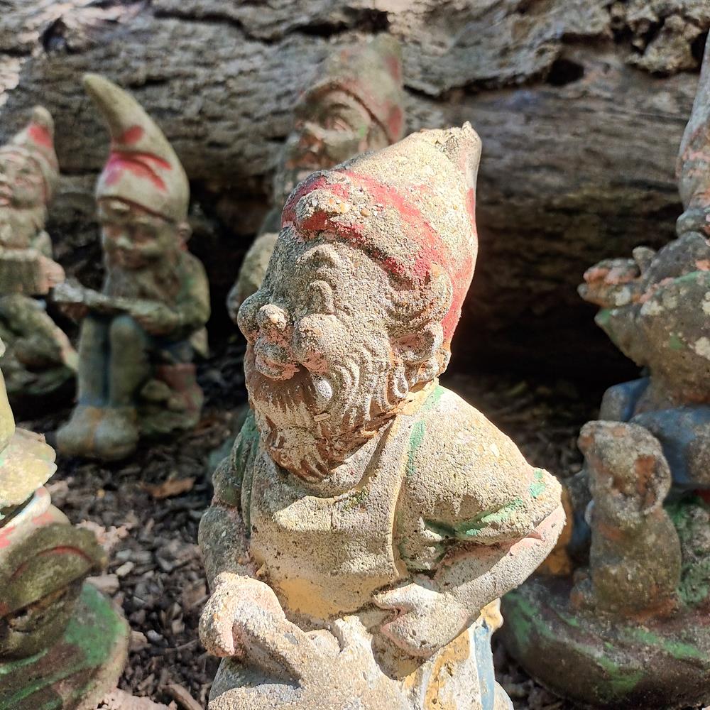 A Set Of Eight Garden Gnomes