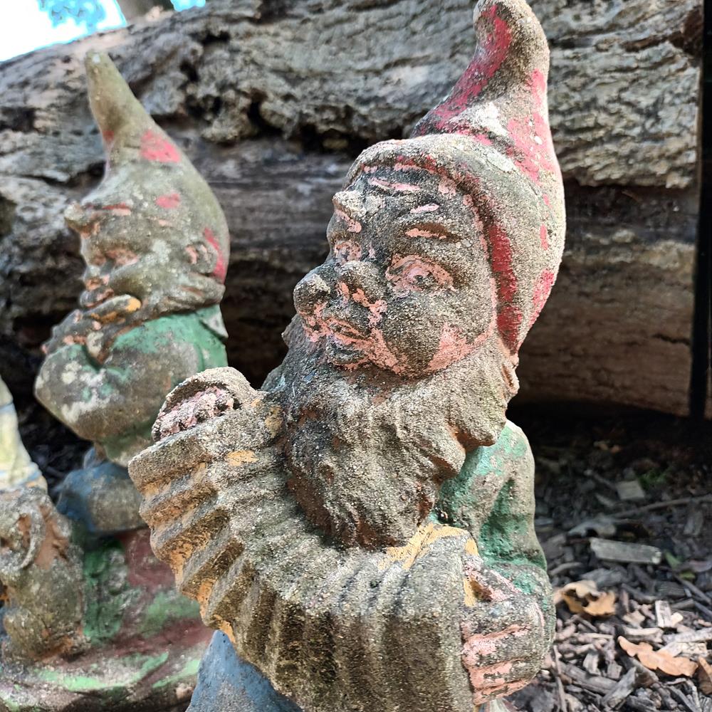 A Set Of Eight Garden Gnomes