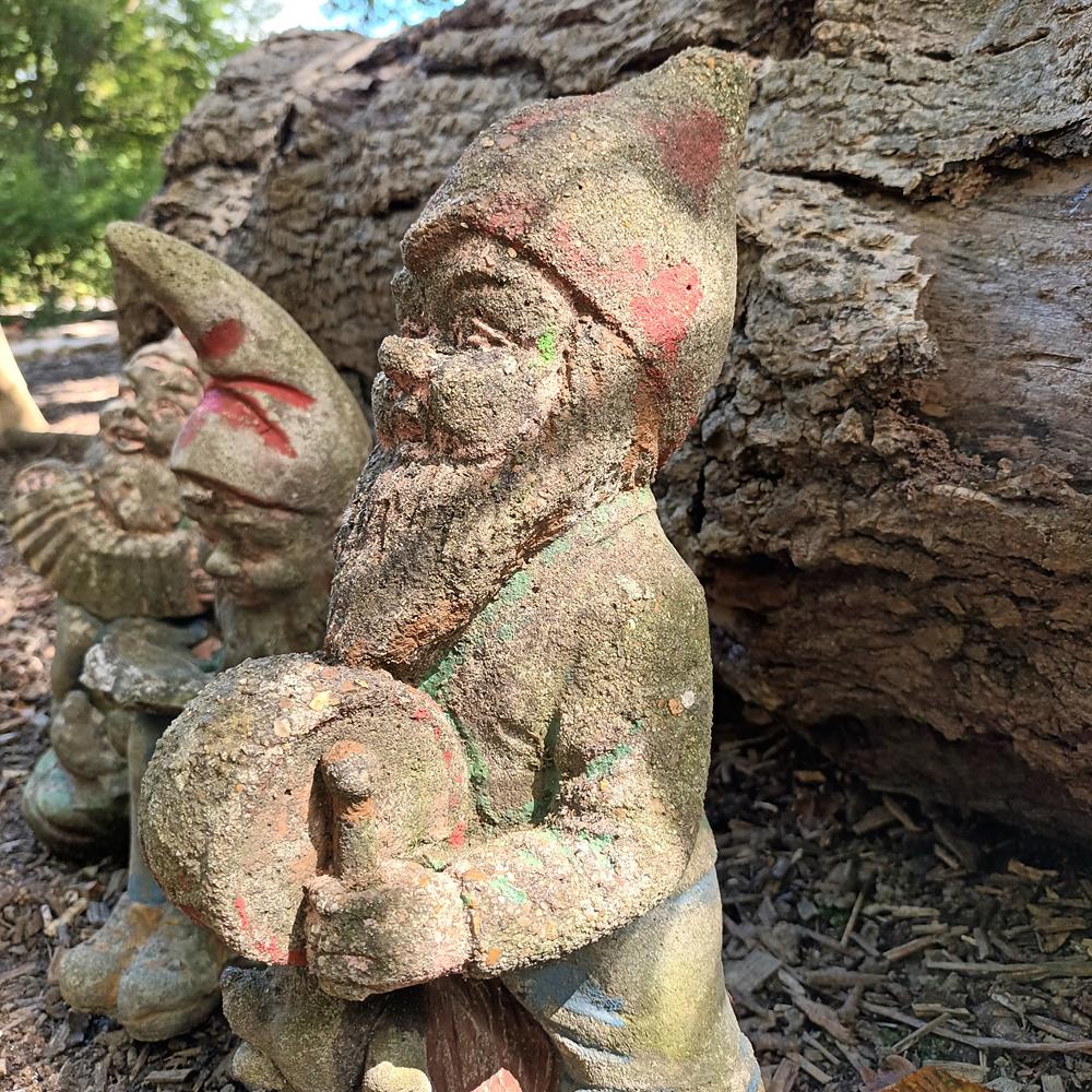 A Set Of Eight Garden Gnomes
