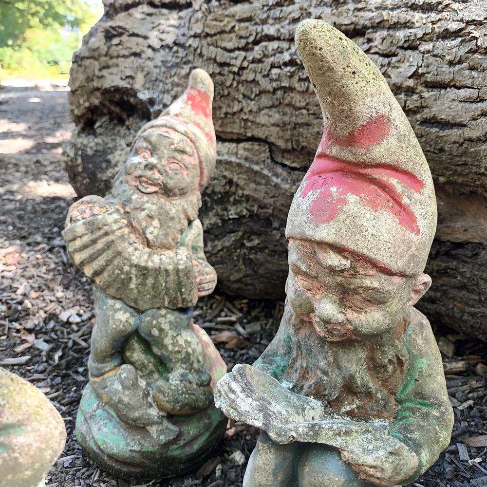 A Set Of Eight Garden Gnomes