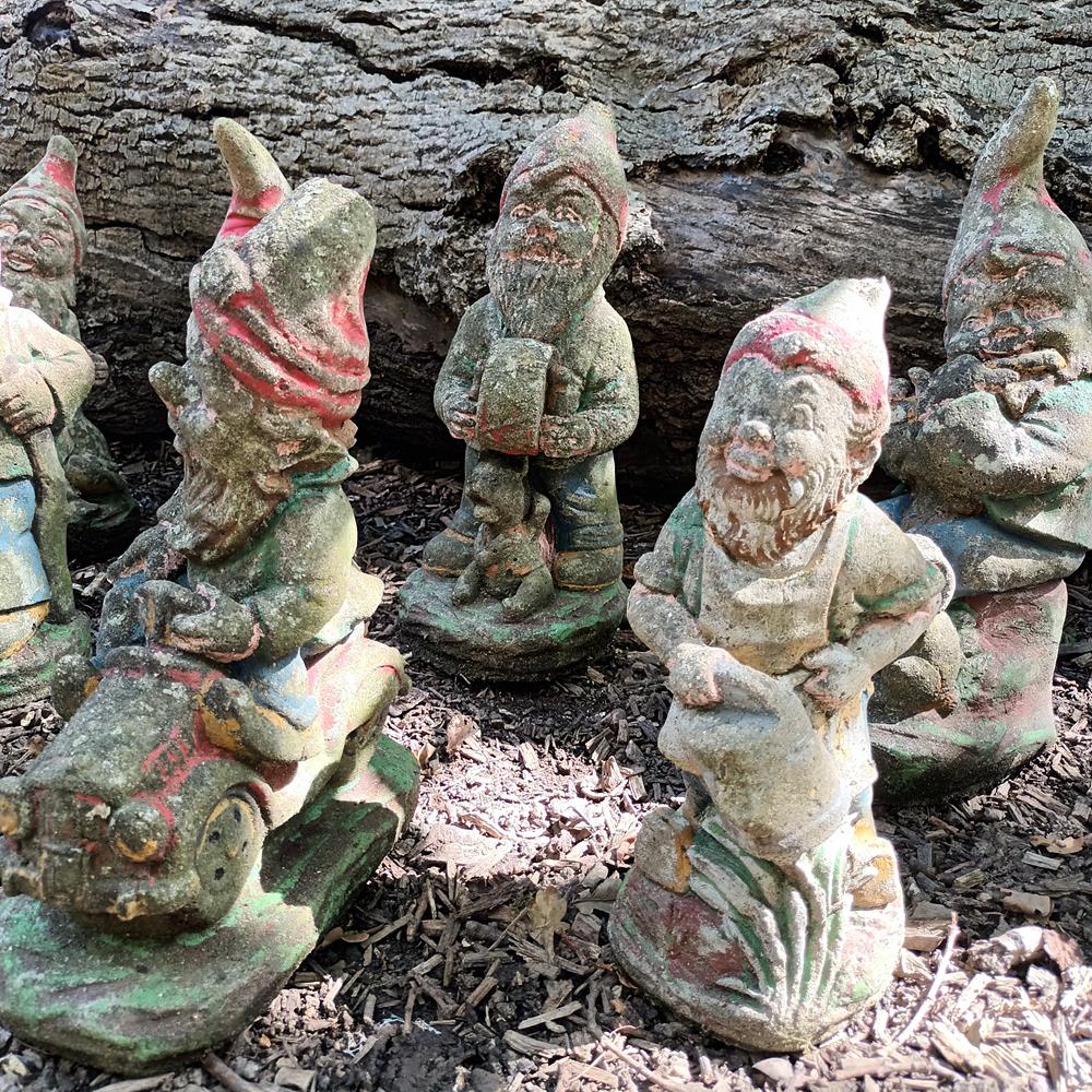 A Set Of Eight Garden Gnomes