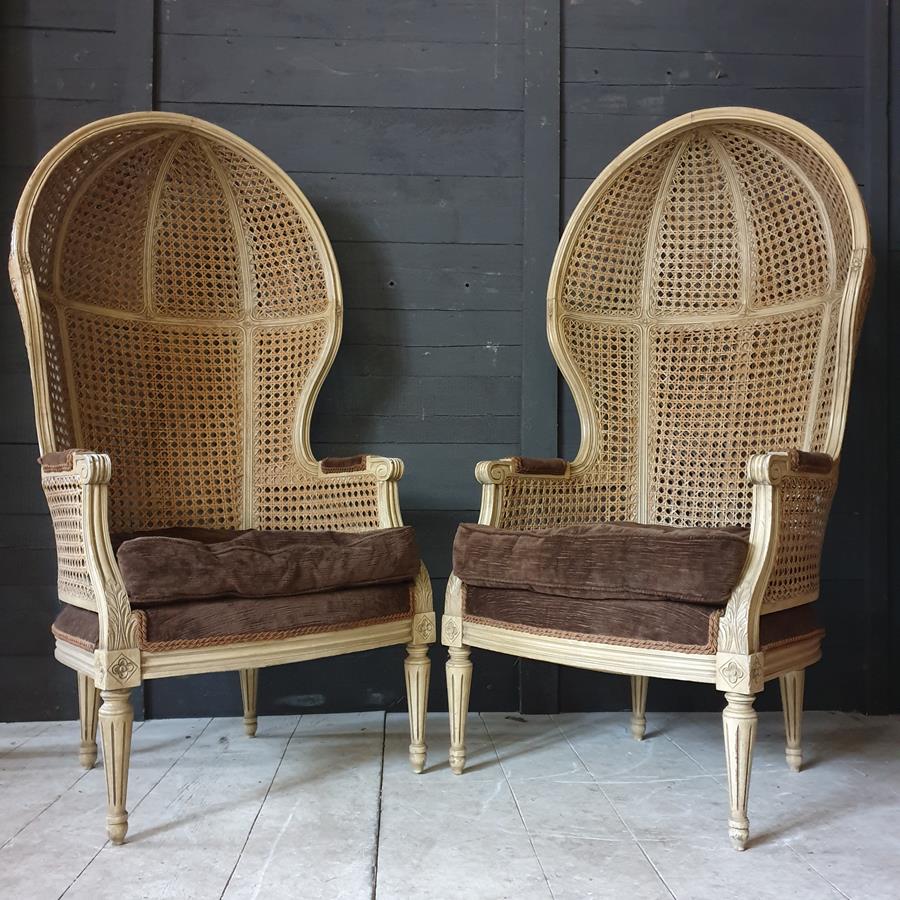 A Pair Of Caned Porters Chairs