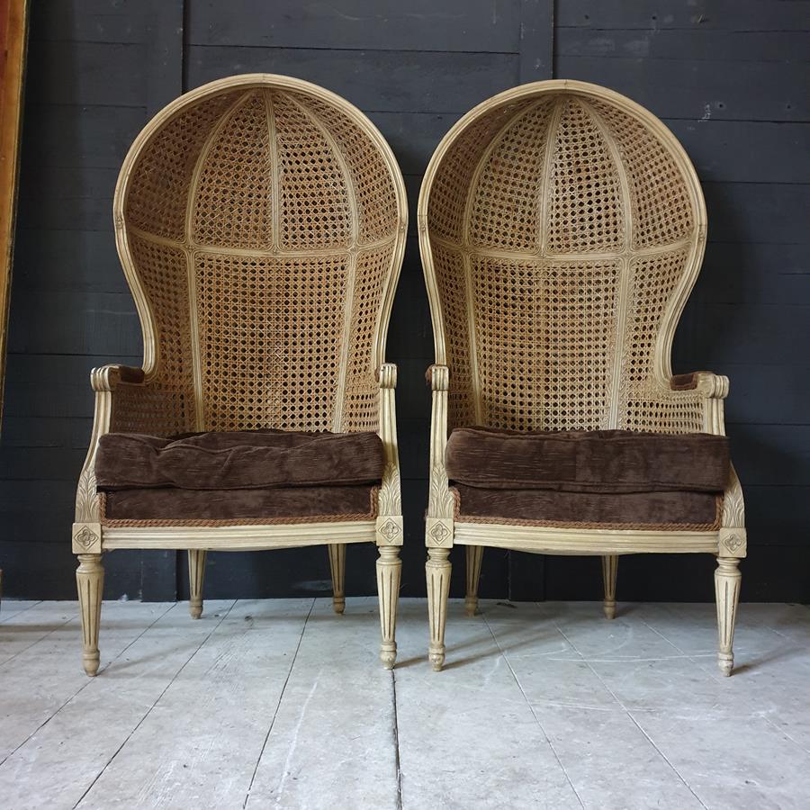 A Pair Of Caned Porters Chairs