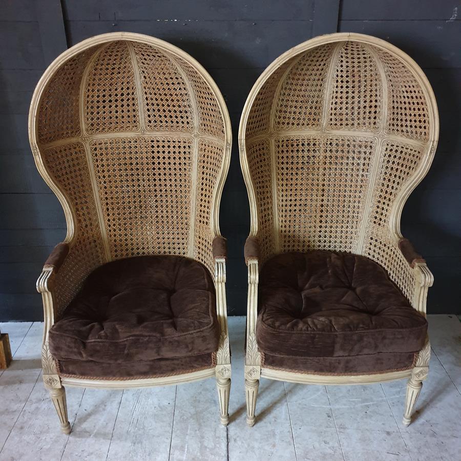 A Pair Of Caned Porters Chairs