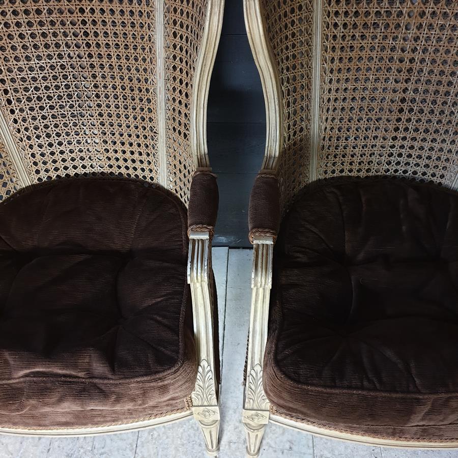 A Pair Of Caned Porters Chairs