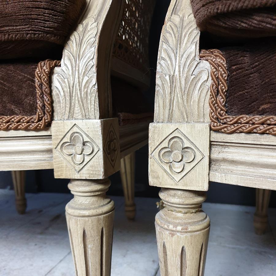 A Pair Of Caned Porters Chairs