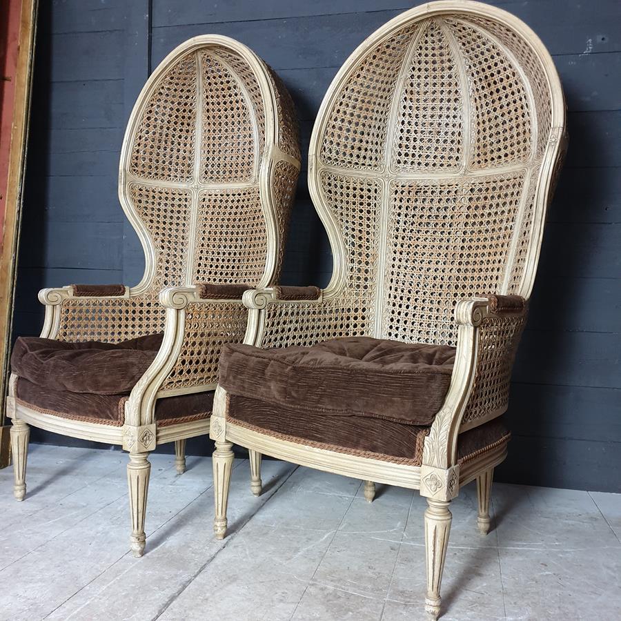 A Pair Of Caned Porters Chairs