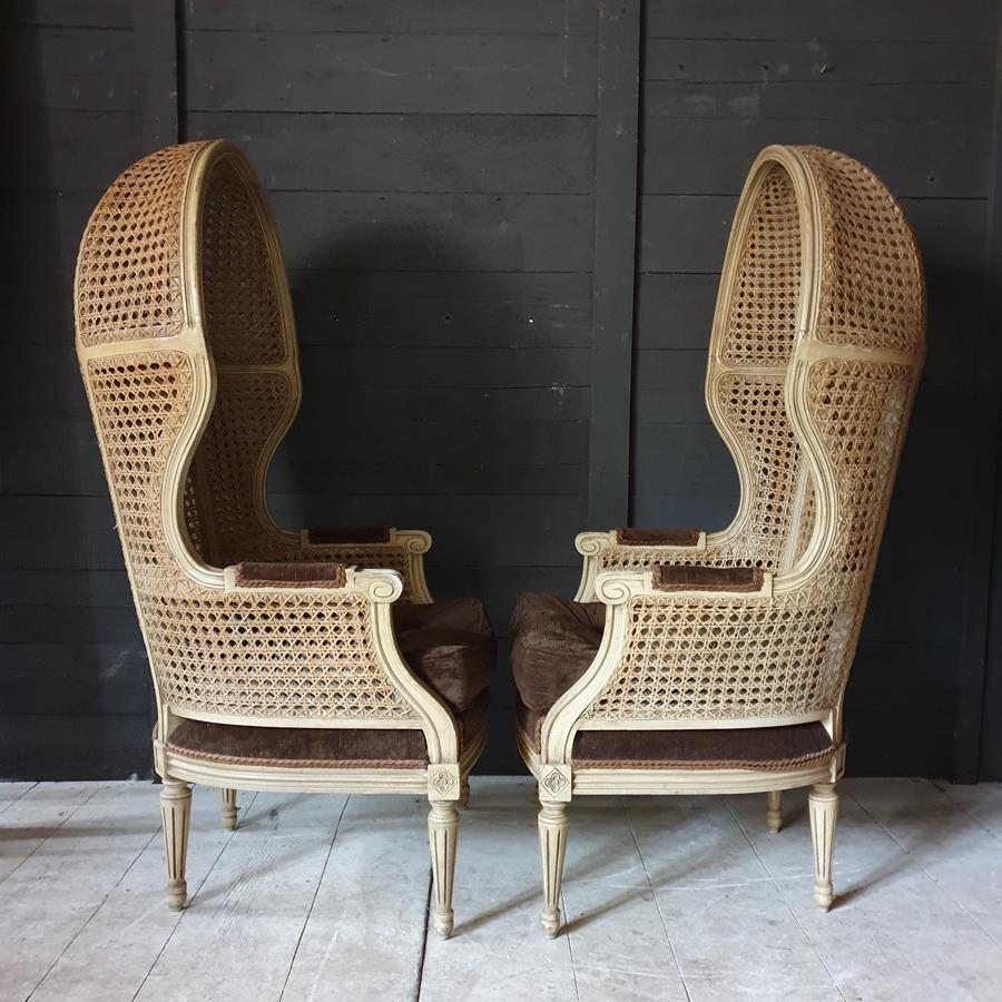 A Pair Of Caned Porters Chairs