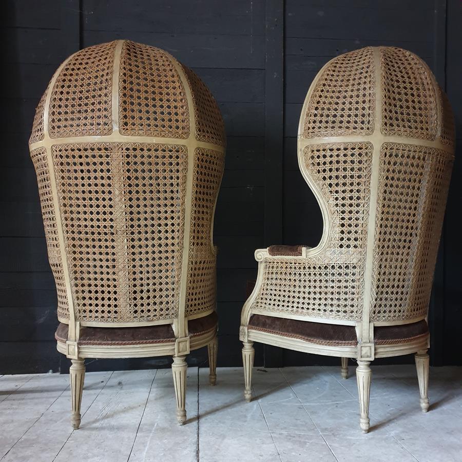 A Pair Of Caned Porters Chairs