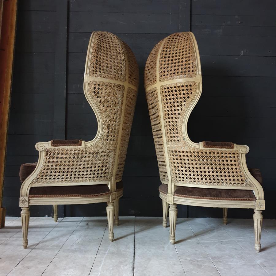 A Pair Of Caned Porters Chairs