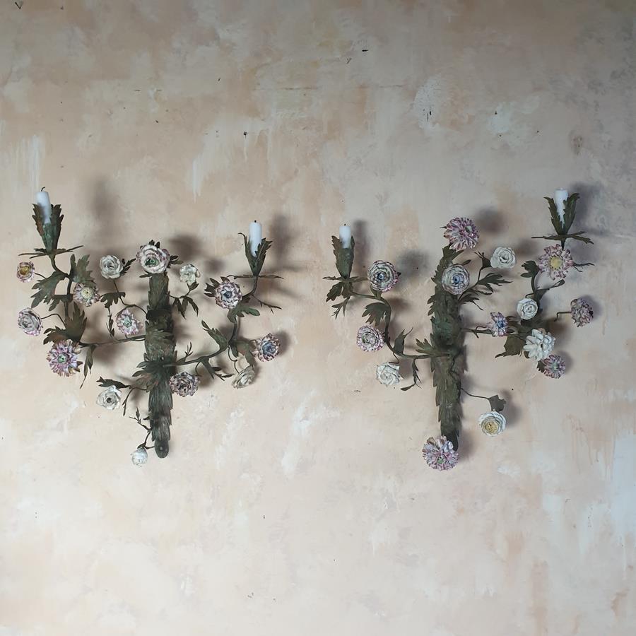 A pair of French painted tôle and porcelain wall-lights