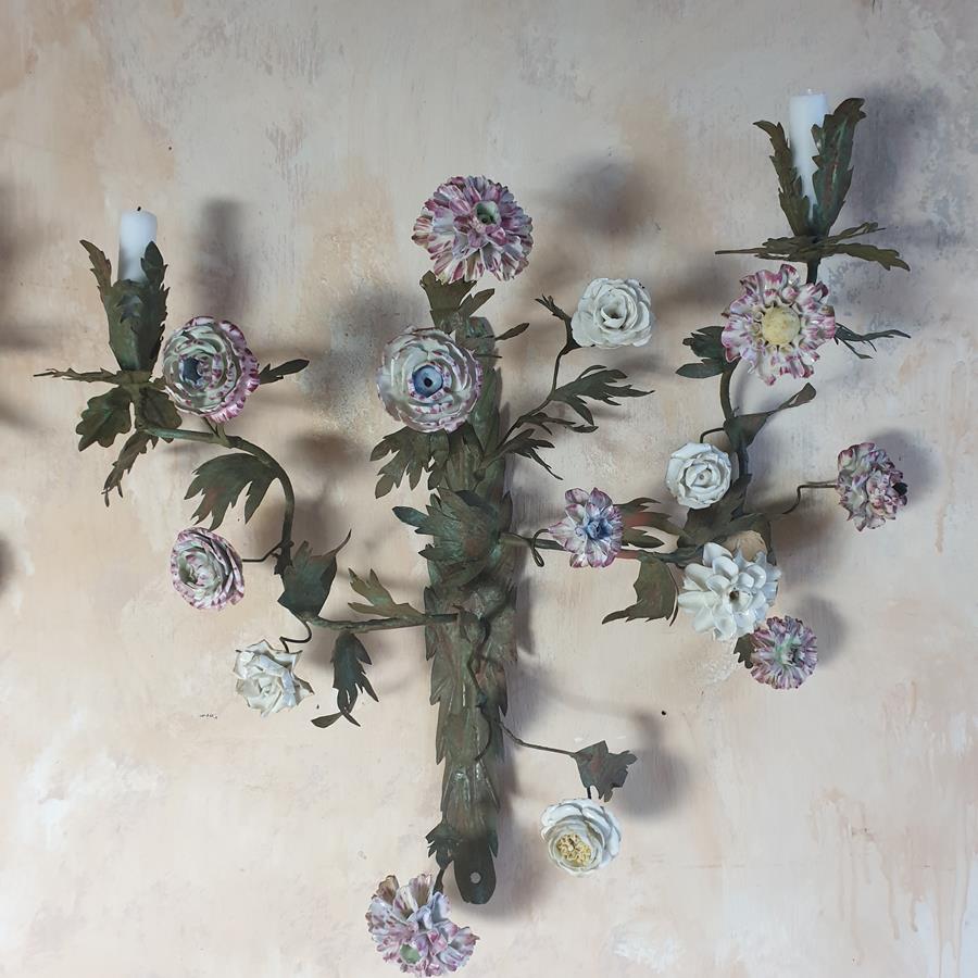 A pair of French painted tôle and porcelain wall-lights
