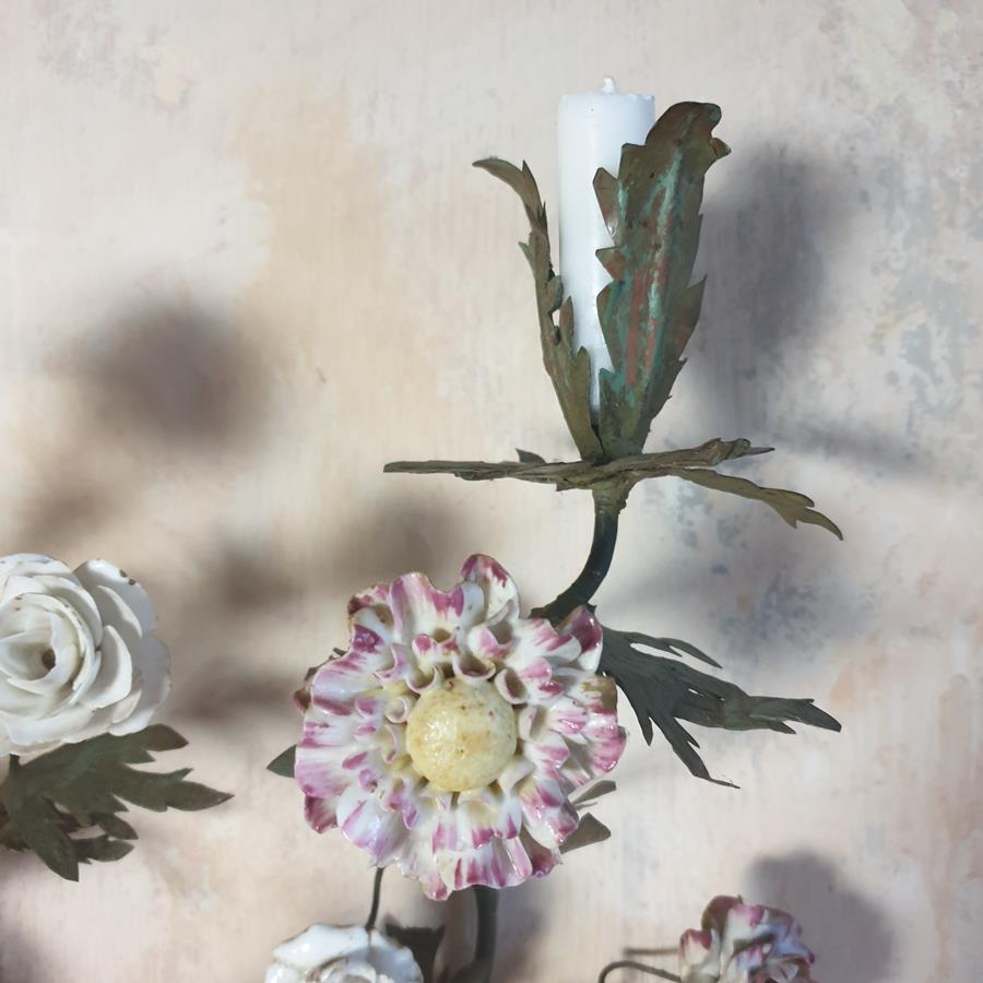 A pair of French painted tôle and porcelain wall-lights