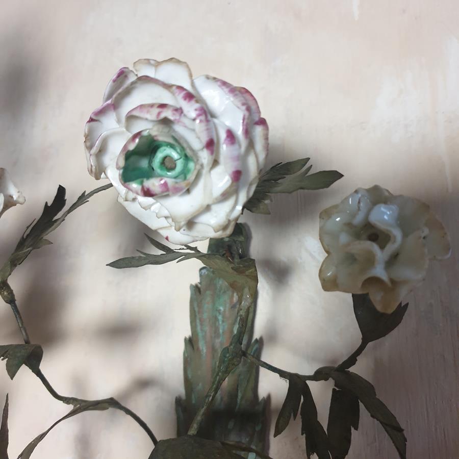 A pair of French painted tôle and porcelain wall-lights