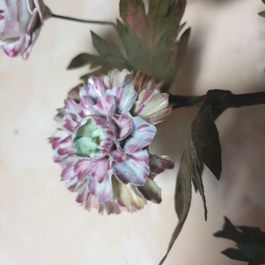 A pair of French painted tôle and porcelain wall-lights
