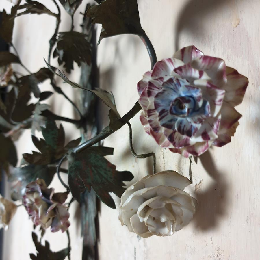 A pair of French painted tôle and porcelain wall-lights