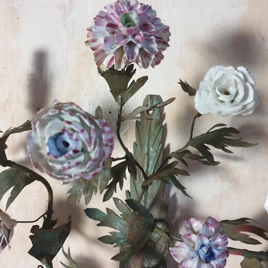 A pair of French painted tôle and porcelain wall-lights