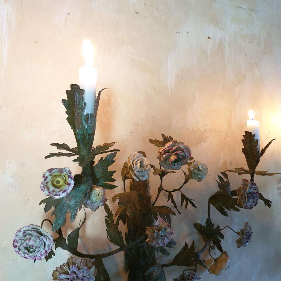 A pair of French painted tôle and porcelain wall-lights