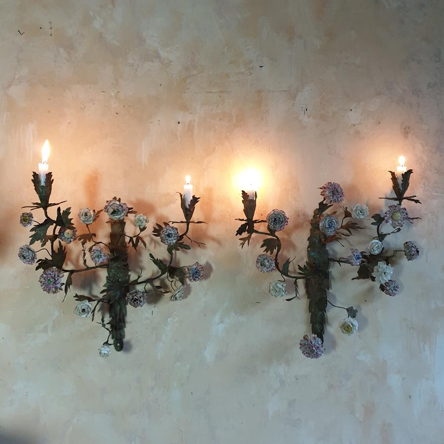 A pair of French painted tôle and porcelain wall-lights