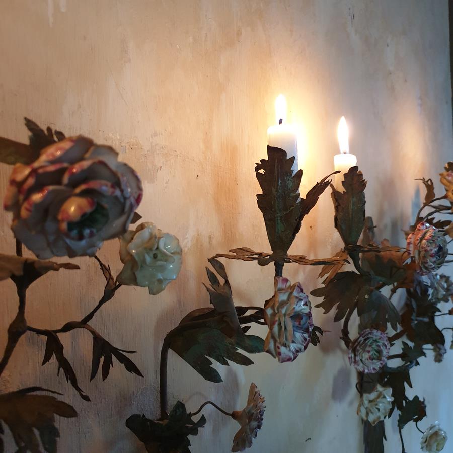 A pair of French painted tôle and porcelain wall-lights