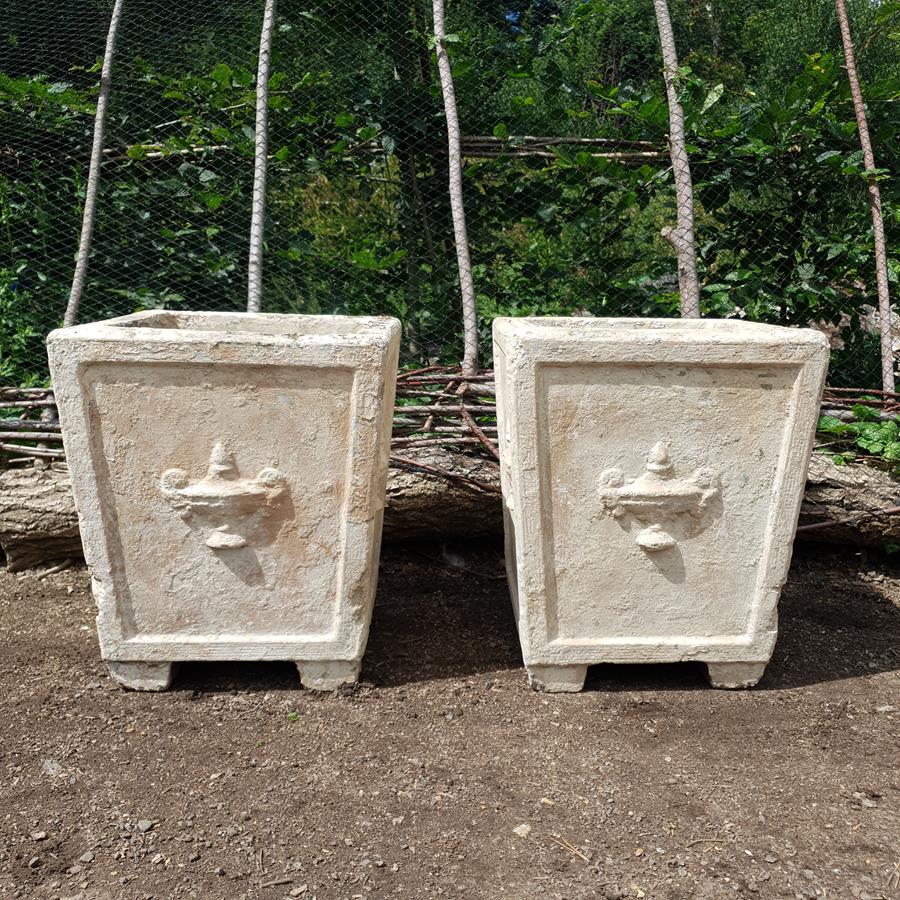 A Pair Of Stone Planters