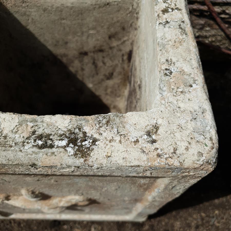 A Pair Of Stone Planters