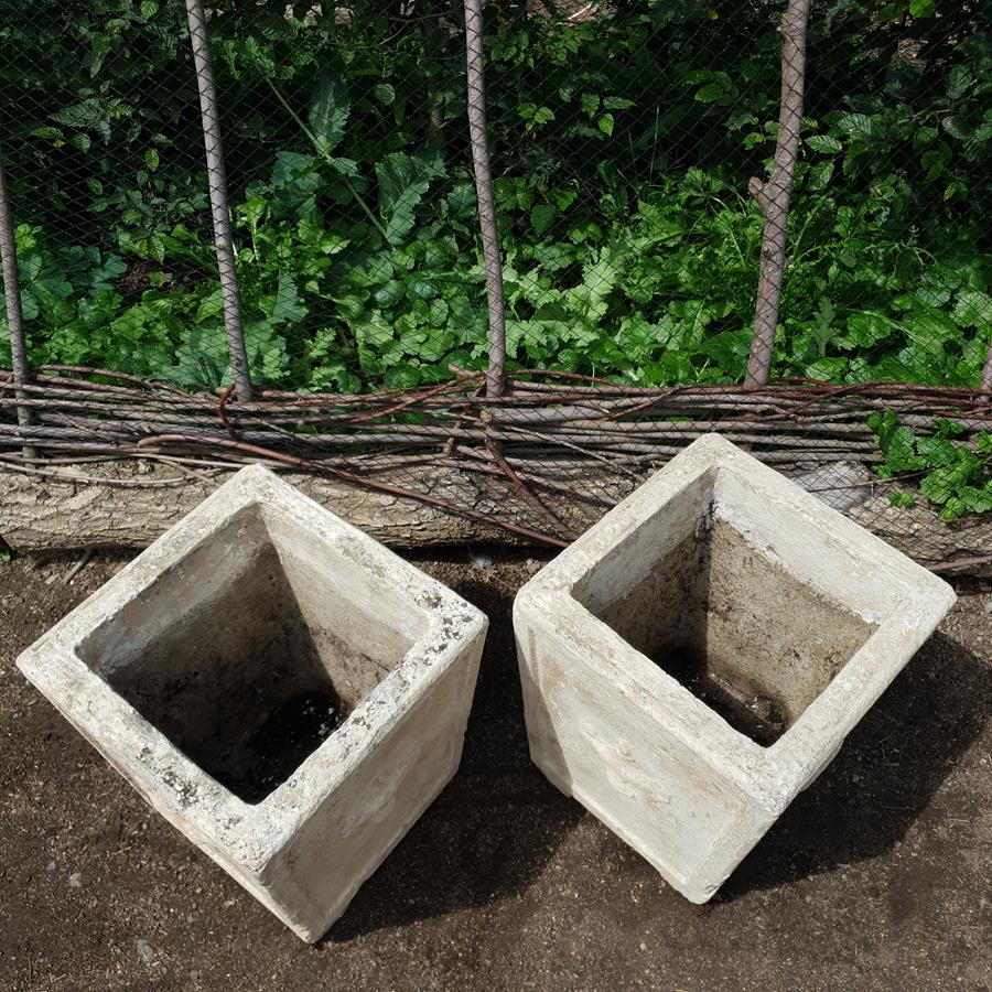 A Pair Of Stone Planters
