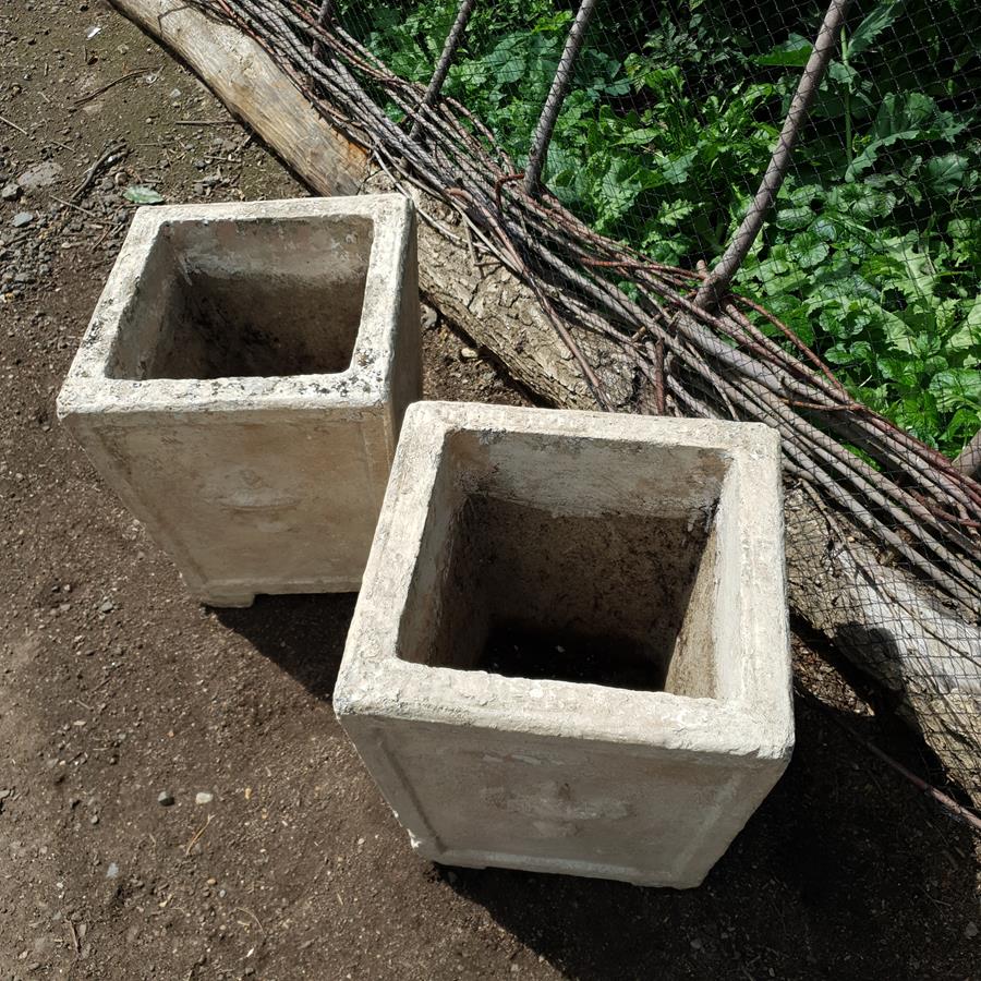 A Pair Of Stone Planters