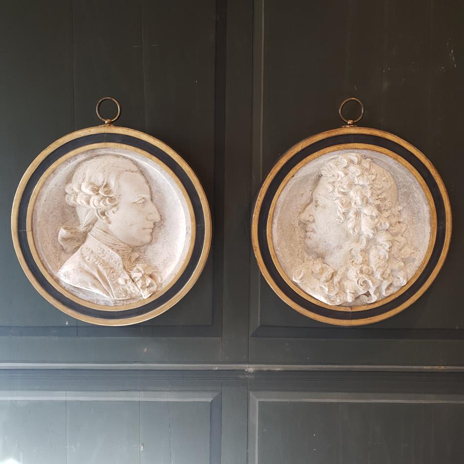 A Pair Of Plaster Roundels