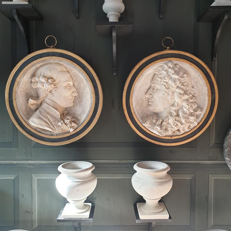 A Pair Of Plaster Roundels