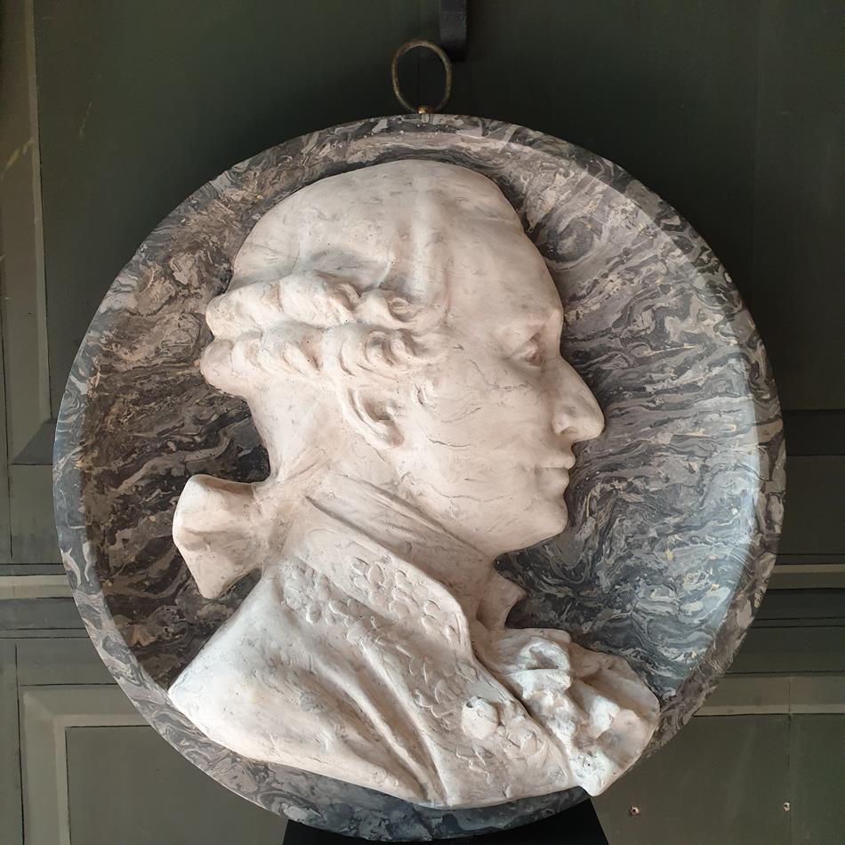 A Pair Of Scagliola Roundels