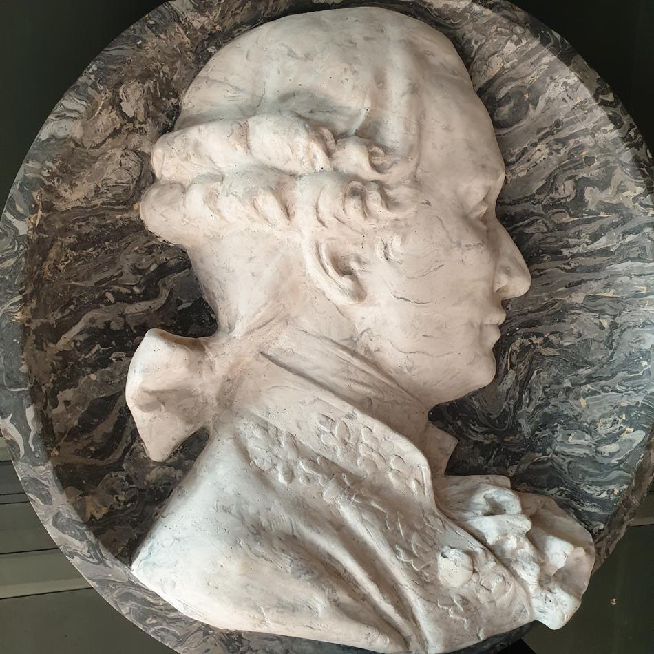 A Pair Of Scagliola Roundels