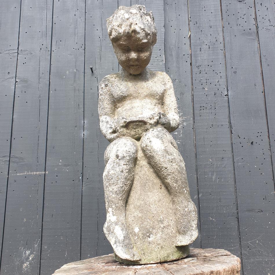 Statue Of A Sitting Girl