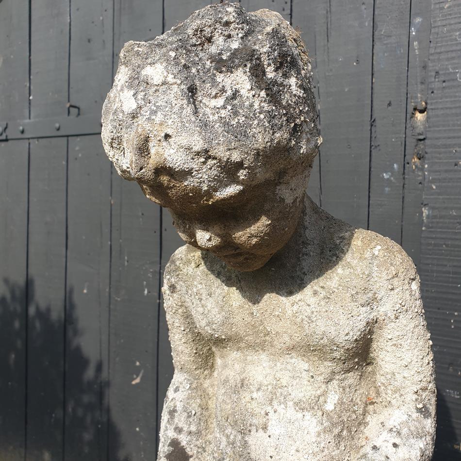 Statue Of A Sitting Girl