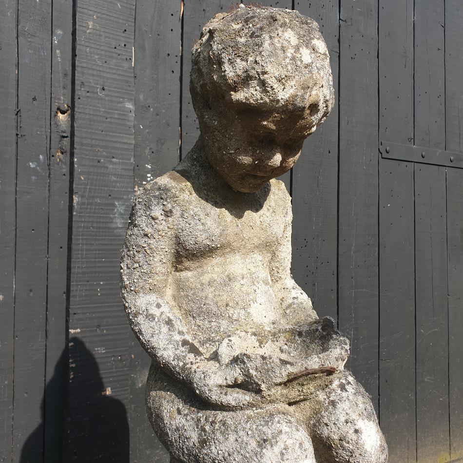 Statue Of A Sitting Girl
