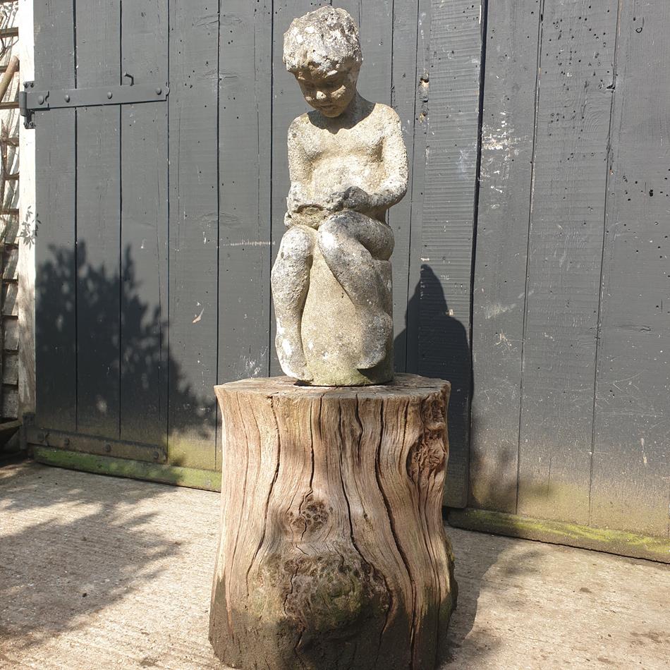 Statue Of A Sitting Girl