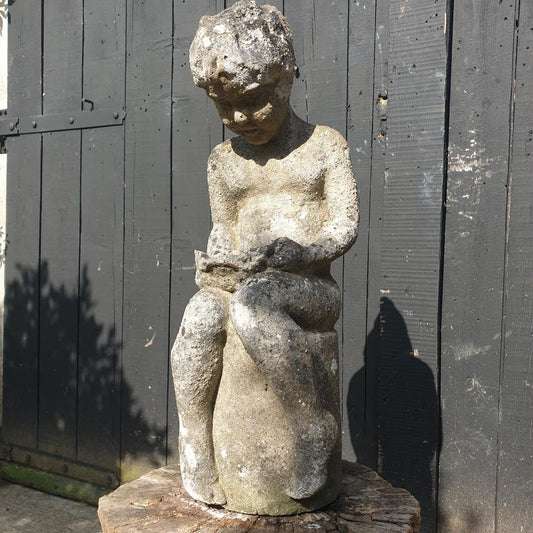 Statue Of A Sitting Girl
