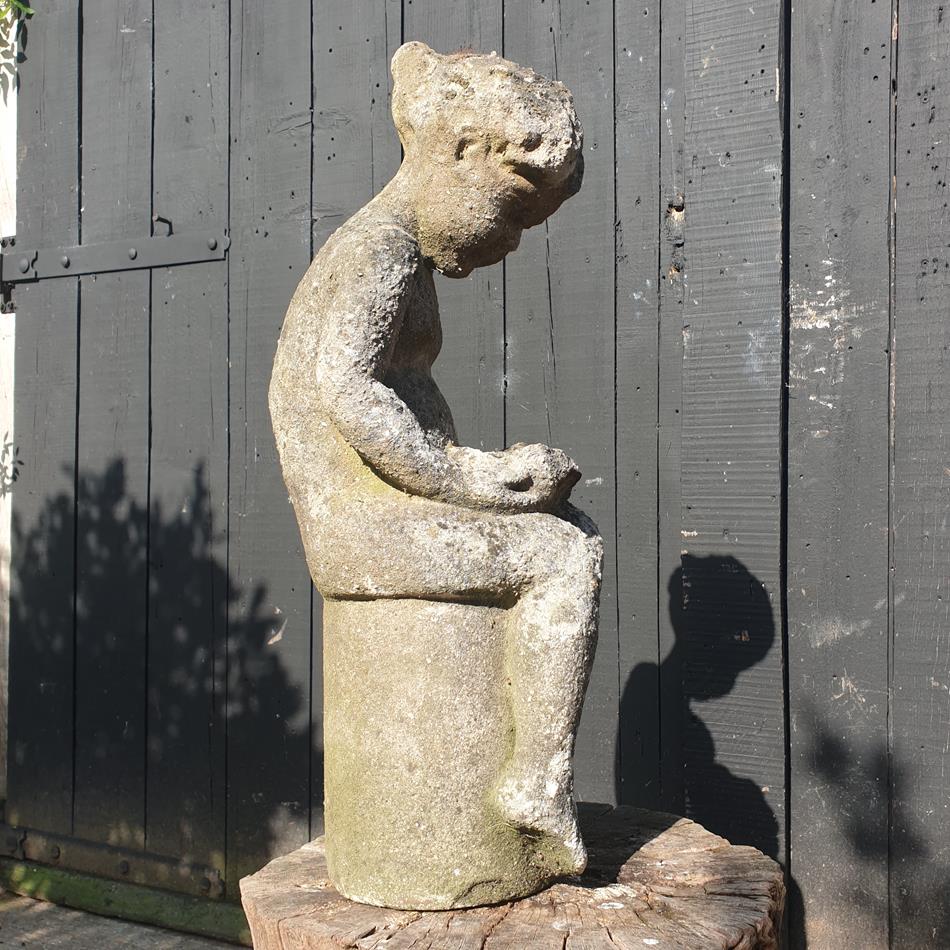 Statue Of A Sitting Girl