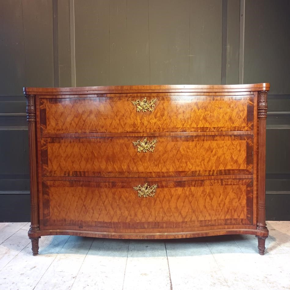 A Late 19th Century Serpentine Satinwood Commode