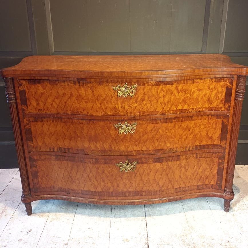 A Late 19th Century Serpentine Satinwood Commode