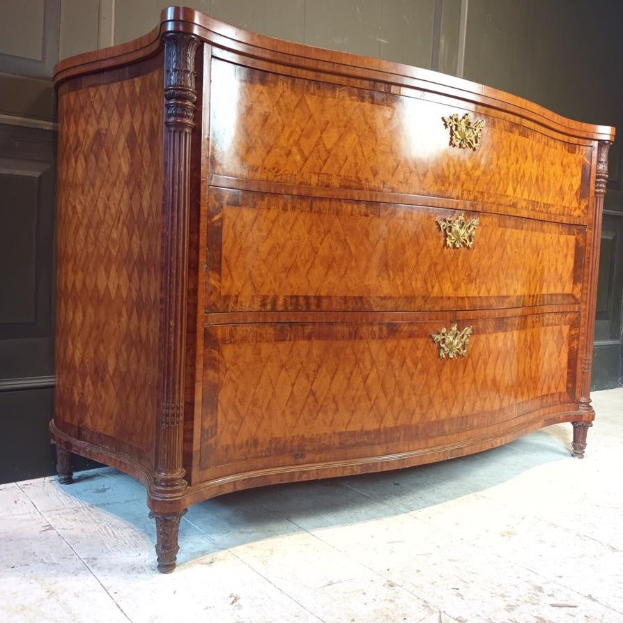 A Late 19th Century Serpentine Satinwood Commode