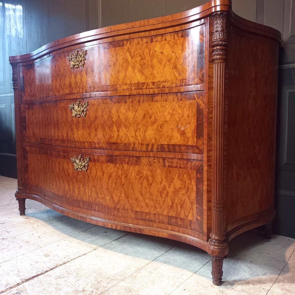 A Late 19th Century Serpentine Satinwood Commode