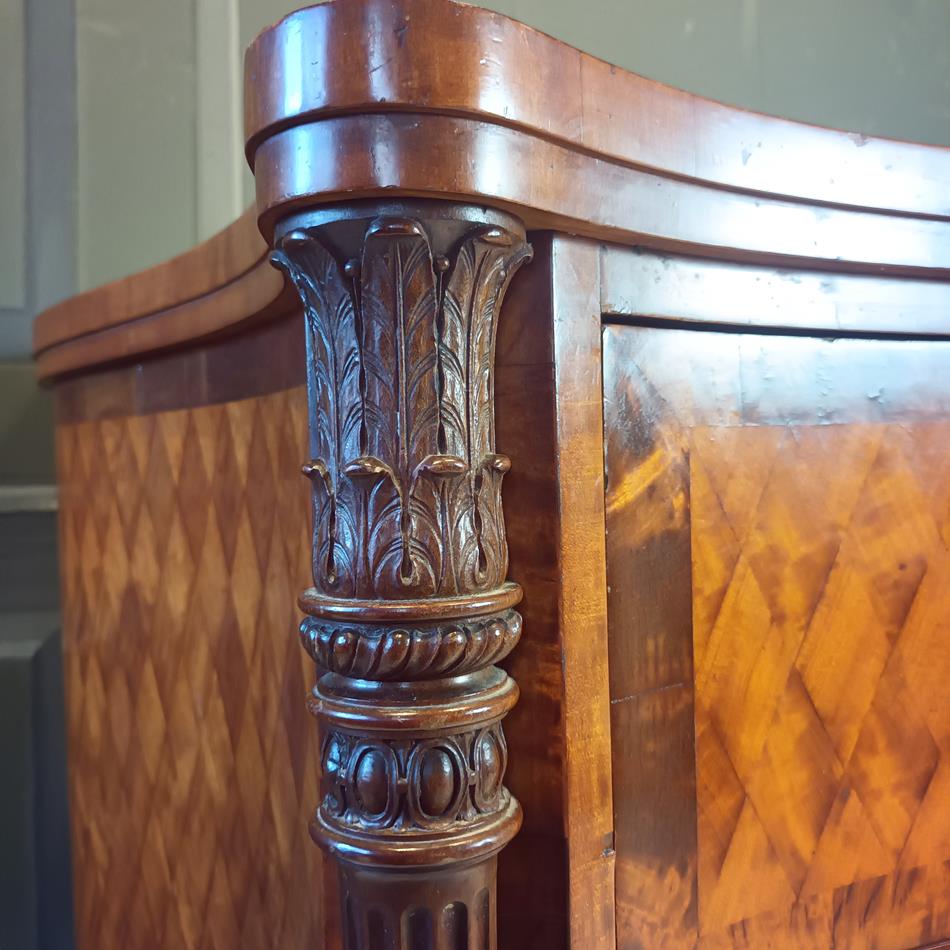 A Late 19th Century Serpentine Satinwood Commode
