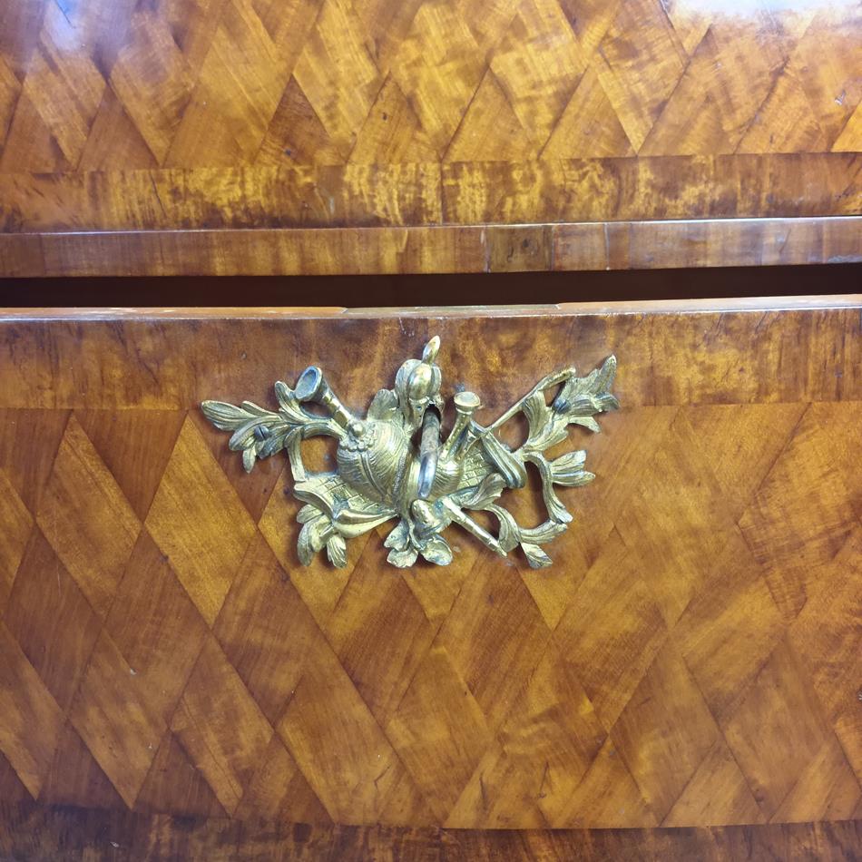 A Late 19th Century Serpentine Satinwood Commode