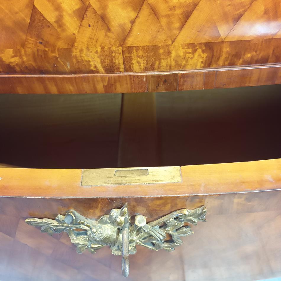 A Late 19th Century Serpentine Satinwood Commode