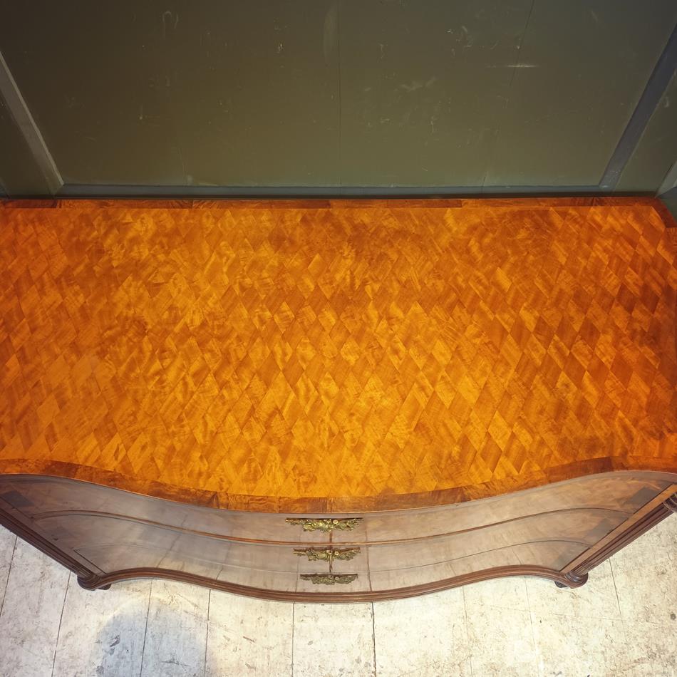 A Late 19th Century Serpentine Satinwood Commode