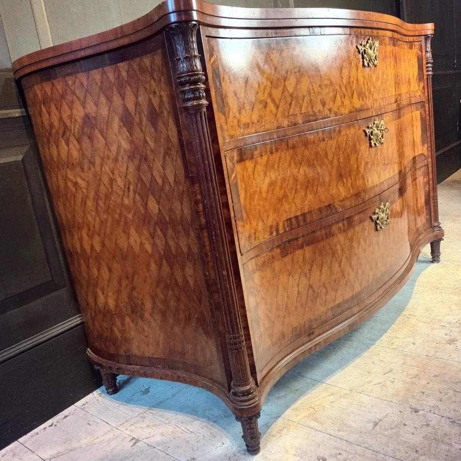 A Late 19th Century Serpentine Satinwood Commode